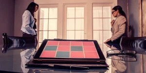 Two parents discuss child custody schedules for their divorce on a tablet.